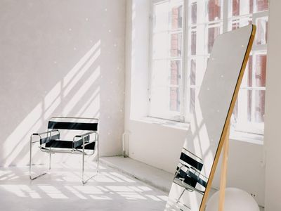 A clean, open space with a yoga mat on the floor.